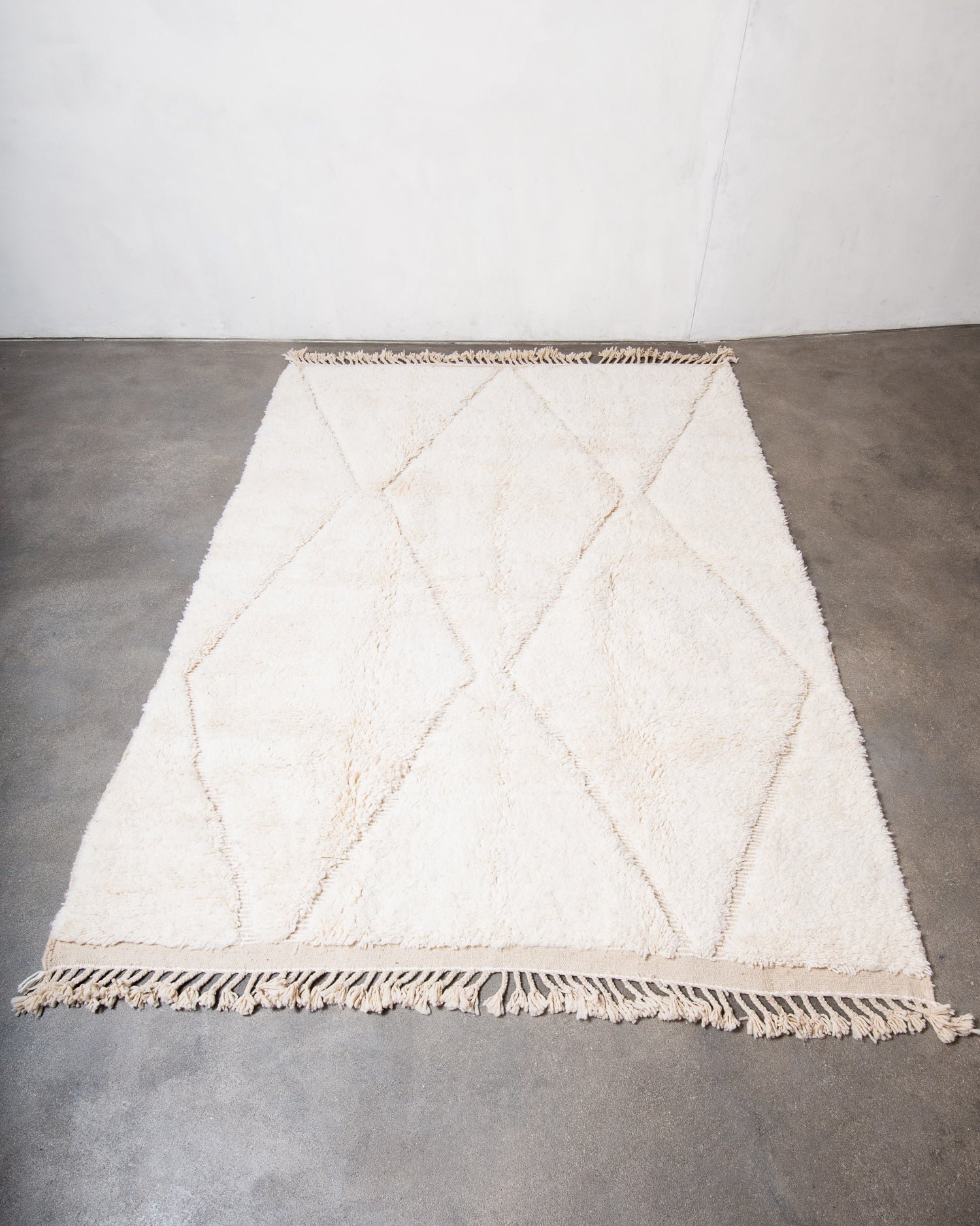 Modern, designer, handcrafted Berber rug from Morocco. Beniourain carpet with minimalist design, natural wool pile and a fluffy texture.